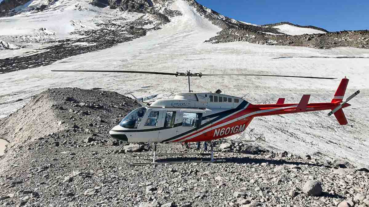 Helicopter flying in mountains