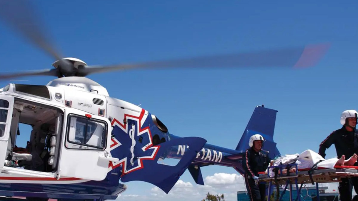 medical helicopter pilots rescuing person on stretcher for a blog about medical transport jobs
