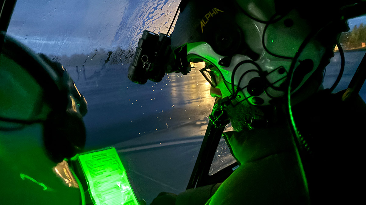pilots in helicopter at night for a blog about helicopter flight course options