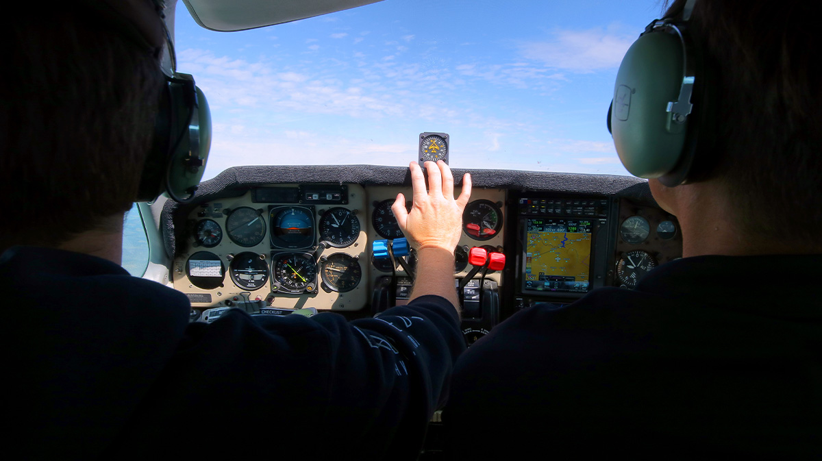 how much does flight school cost? two pilot POV flying in helicopter