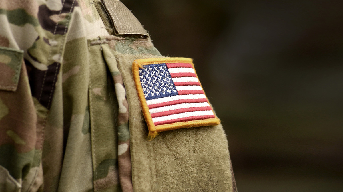 Military uniform and patch on sleeve for a blog about va approved flight schools